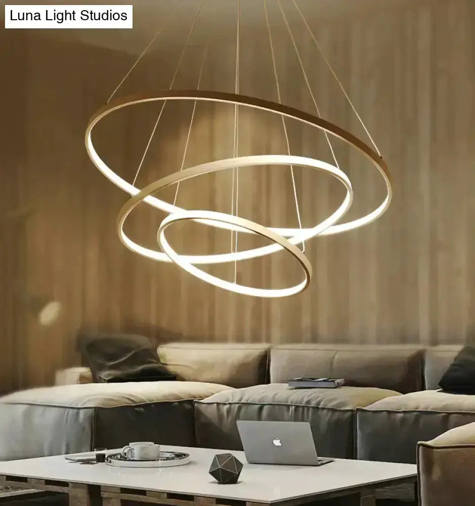 Decorbites modern interlocking ring LED pendant light with three rings and warm white glow on Tampa Home & Garden Store