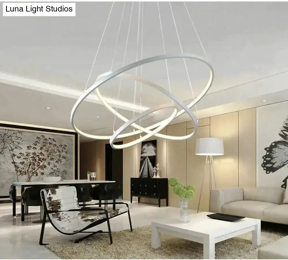 Pendant lights: interlocking ring LED pendant lights by Decorbites in a modern living room on Tampa Home & Garden Store