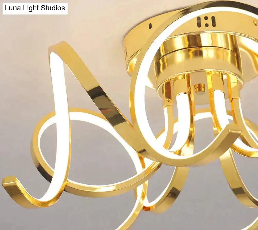 Modern gold iron ring pendant light with illuminated circular loops for bedroom on Tampa Home & Garden Store