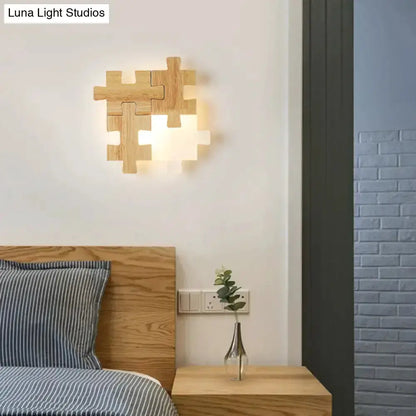 Modern jigsaw wood wall lamp sconce with wood puzzle pieces and warm LED light Decorbites on Tampa Home & Garden Store