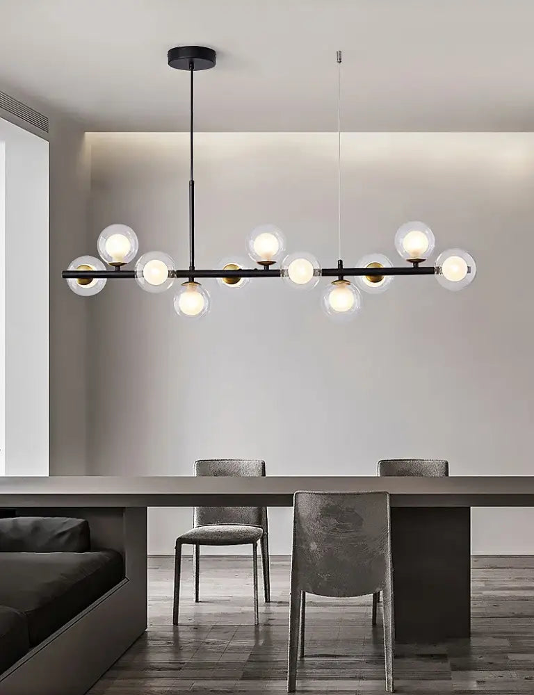 Black Gold Adjustable Ring Chandelier with globe bulbs over dining area Decorbites on Tampa Home & Garden Store