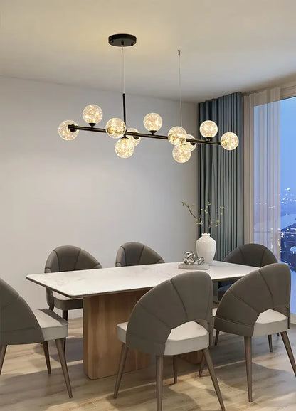 Black Gold Adjustable Ring Chandelier for Dining with glass orb bulbs over marble dining table on Tampa Home & Garden Store