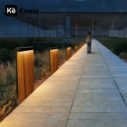 Decorbites LED wood-grain pathway lamp; warm amber outdoor lighting lines a walkway on Tampa Home & Garden Store