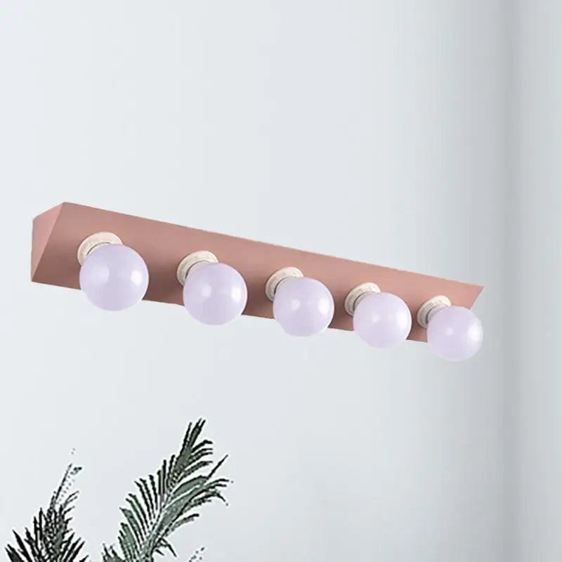 Pink Yellow Vanity Sconce Bare Bulb Design five-bulb bar with lavender bulbs Decorbites on Tampa Home & Garden Store