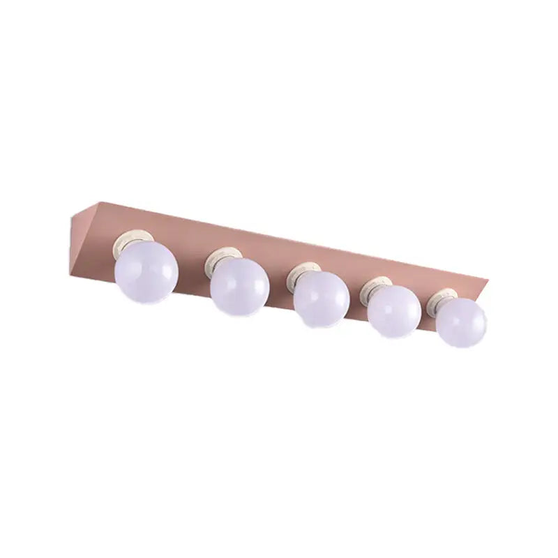 Pink vanity sconce with five bare bulbs in a bar fixture on Tampa Home & Garden Store