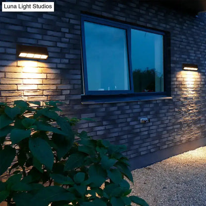 Modern matte black LED outdoor wall sconce pair on brick exterior wall 110-120V Decorbites on Tampa Home & Garden Store