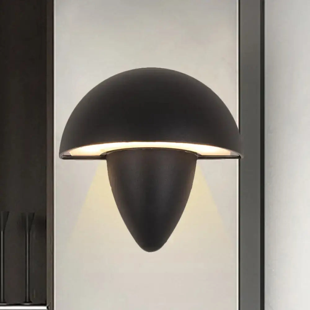 Black Mushroom Wall Sconce by Decorbites; matte black metal dome wall light with warm glow on Tampa Home & Garden Store