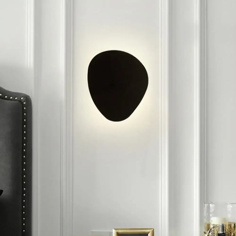 Black triangle 10-inch wall lamp by Decorbites, wall-mounted accent light with warm glow on Tampa Home & Garden Store