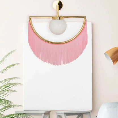 White glass wall sconce with pink tassel fringe by Decorbites on Tampa Home & Garden Store