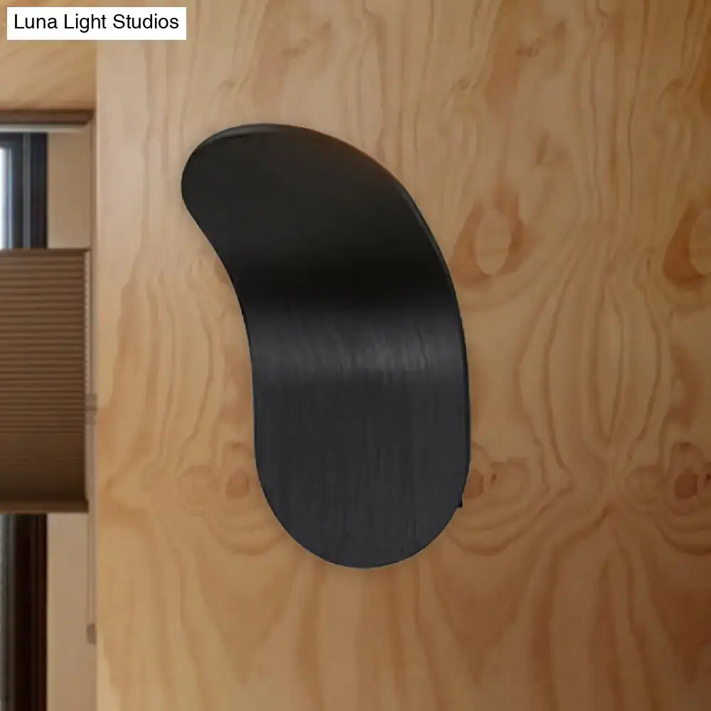 Black metal curved wall sconce bracket with industrial design mounted on wood wall on Tampa Home & Garden Store
