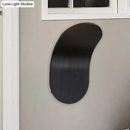 Black industrial wall sconce bracket by Decorbites, curved flat metal design on Tampa Home & Garden Store