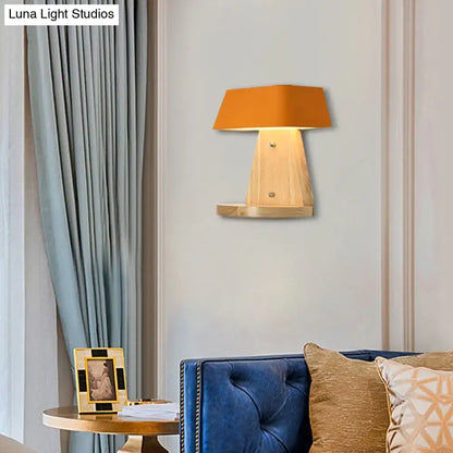 White Metal Wood Backplate Sconce with warm orange lampshade on Tampa Home & Garden Store