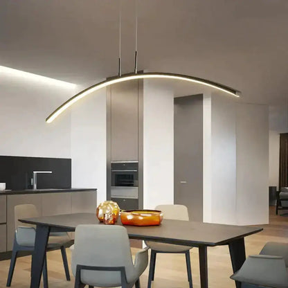 Pendant light Decorbites arc-shaped metallic LED fixture over dining table on Tampa Home & Garden Store