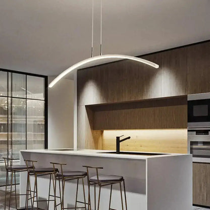 Pendant light modern metallic arc shape LED fixture by Decorbites over white kitchen island on Tampa Home & Garden Store