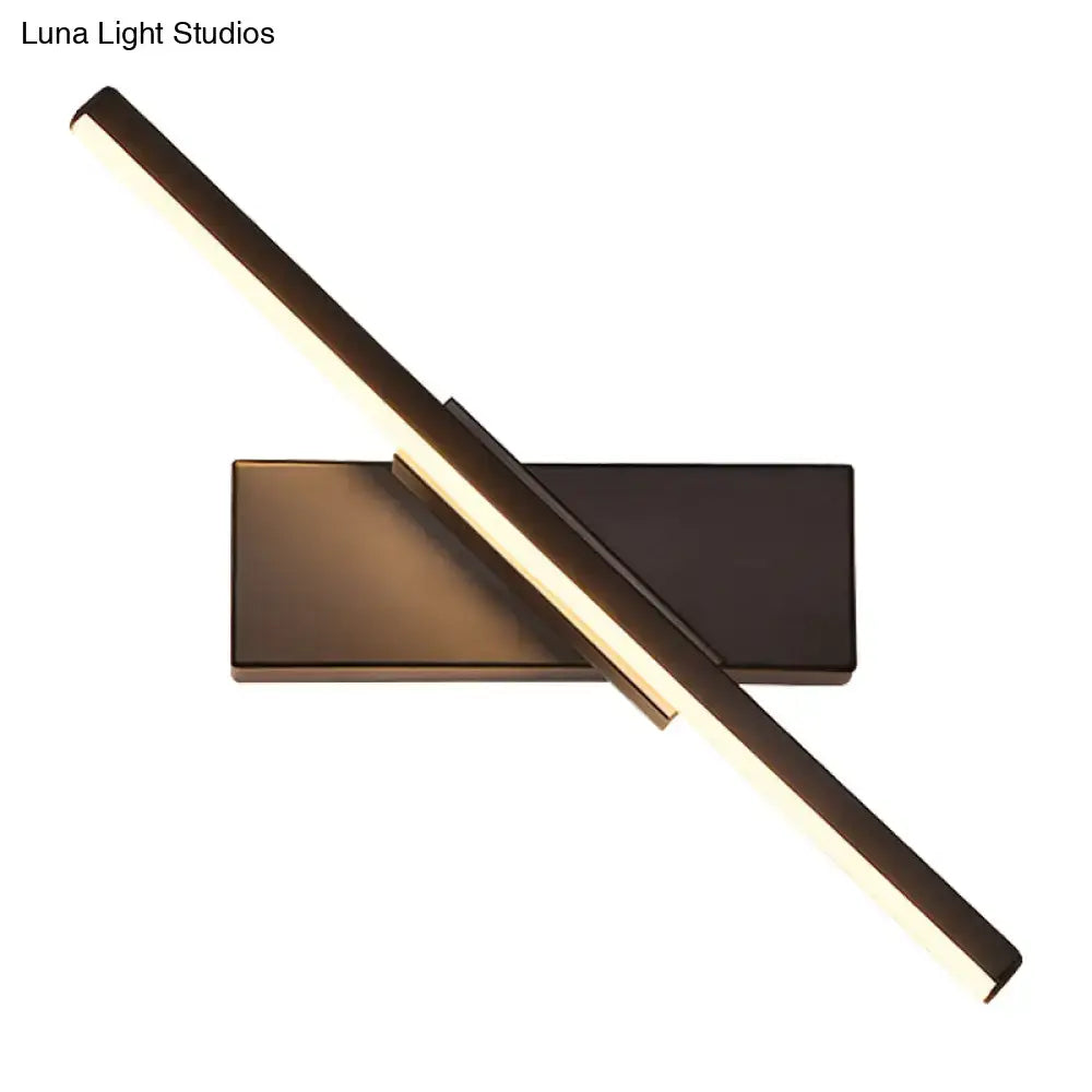 Black vanity sconce with diagonal LED light bar on a rectangular backplate on Tampa Home & Garden Store