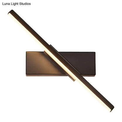 Black vanity sconce with diagonal LED light bar on a rectangular backplate on Tampa Home & Garden Store