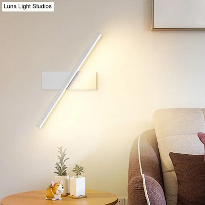 Black White Vanity Sconce by Decorbites, diagonal white wall light with warm glow on Tampa Home & Garden Store