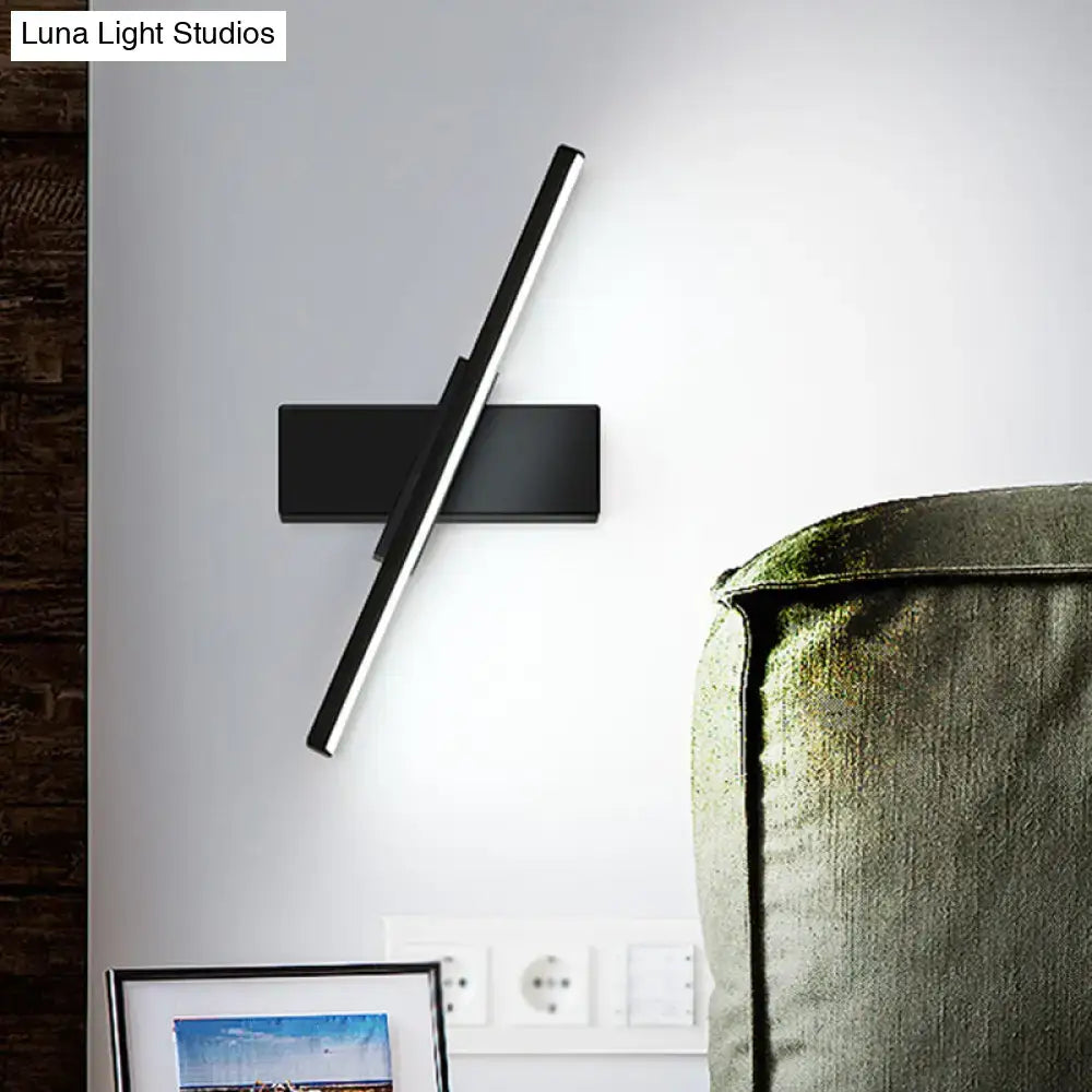 Black and white metal vanity sconce with a diagonal LED light bar on Tampa Home & Garden Store