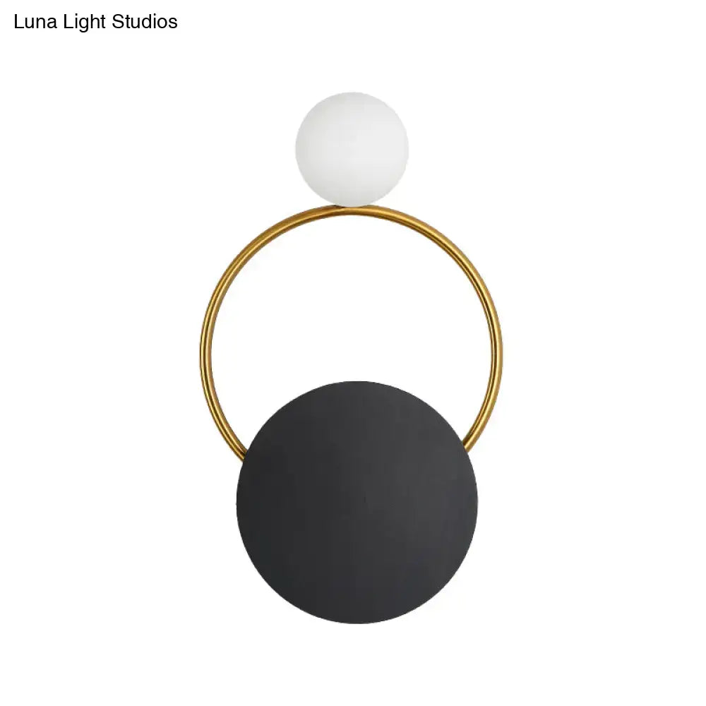 Black Gold Wall Light Sconce with a gold ring frame, white glass globe, and black disk shade on Tampa Home & Garden Store