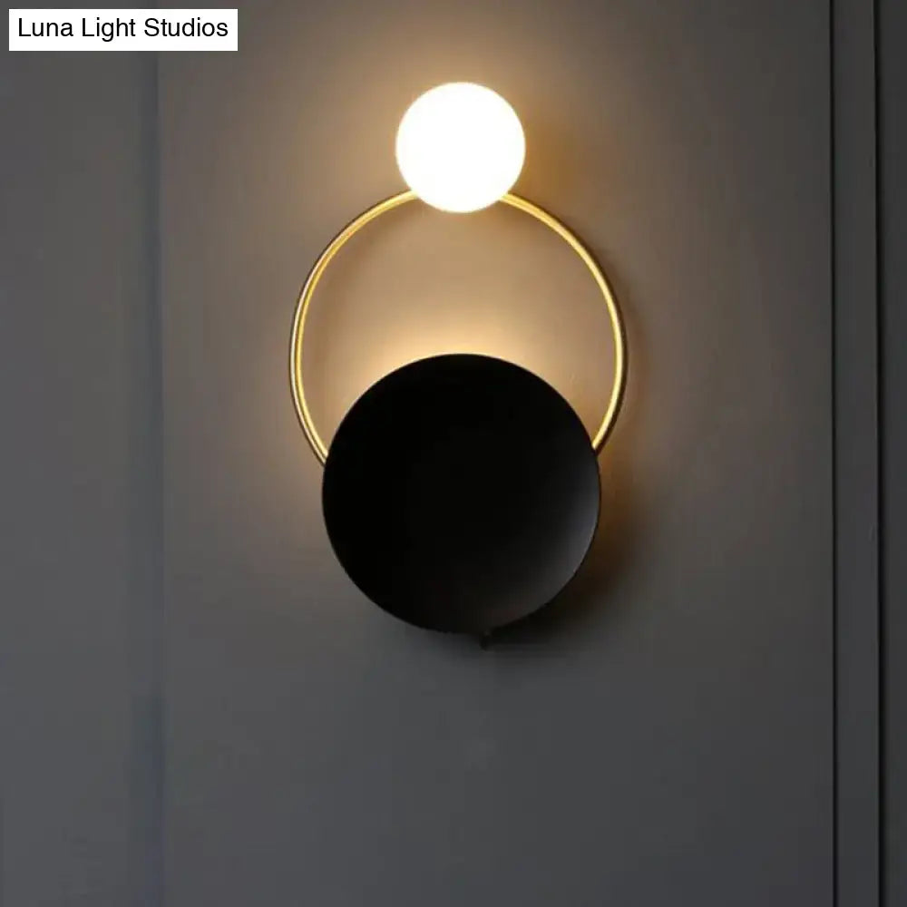 Black Gold Wall Light Sconce Decorbites with white globe, gold ring, and black disk on Tampa Home & Garden Store
