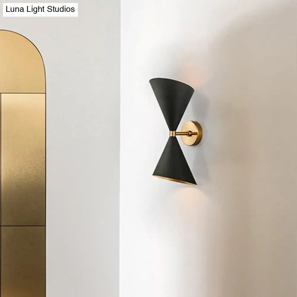 Black gold cast iron dual-bulb wall sconce with brass mount on Tampa Home & Garden Store