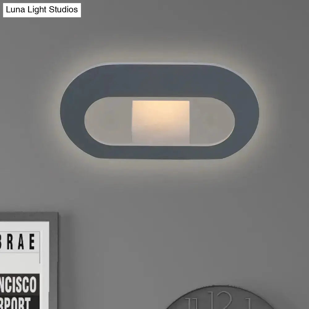 Modern minimalist black and grey oval shade wall lamp for bedroom lighting with warm glow on Tampa Home & Garden Store