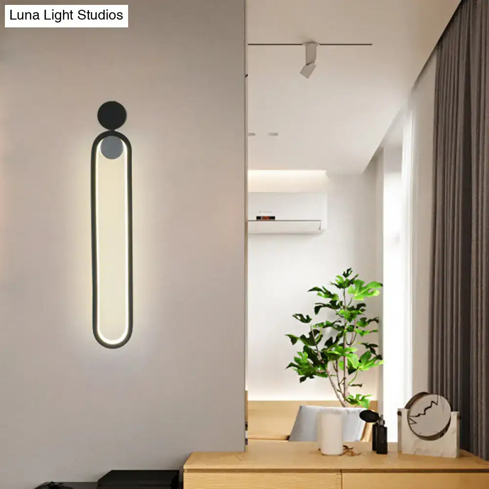 Black adjustable LED sconce by Decorbites with vertical glowing panel in black metal on Tampa Home & Garden Store