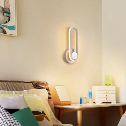 Decorbites matte oval wall sconce in white with integrated LED, modern bedroom lighting on Tampa Home & Garden Store
