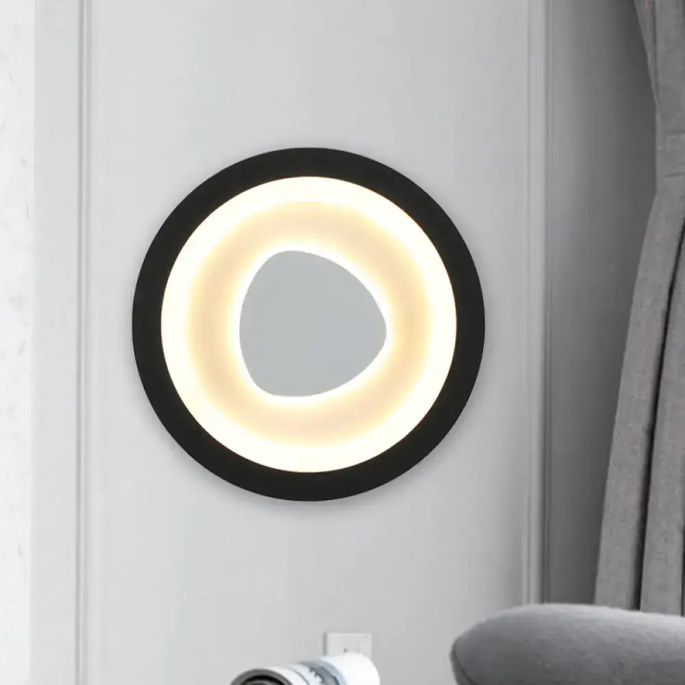 Black Mirror Wall Light with black circular frame and warm LED halo around a gray center on Tampa Home & Garden Store