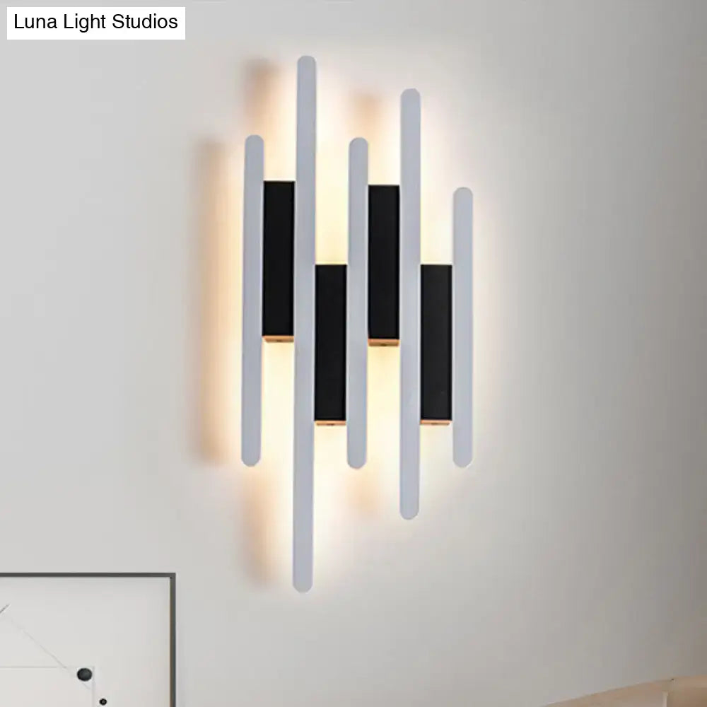 White acrylic wall sconce with multi-height vertical bars and warm backlight Decorbites on Tampa Home & Garden Store