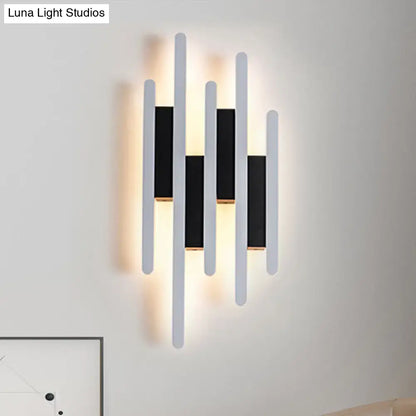 White acrylic wall sconce with multi-height vertical bars and warm backlight Decorbites on Tampa Home & Garden Store