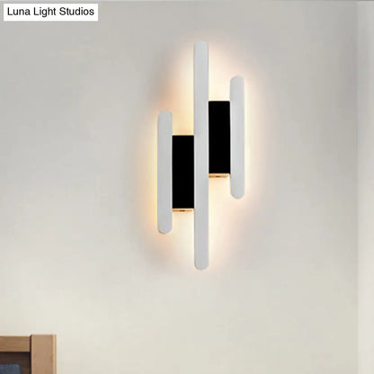 White Acrylic Wall Sconce with three multi-height vertical bars in white/black by Decorbites on Tampa Home & Garden Store