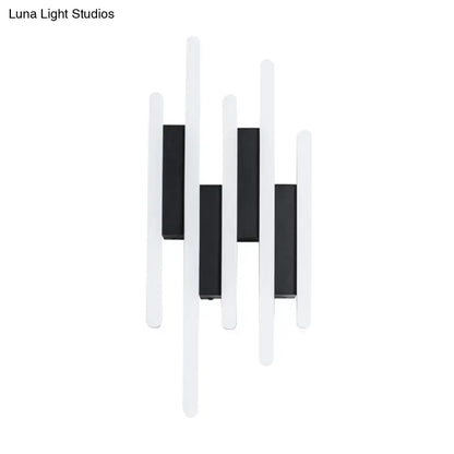 White acrylic wall sconce with multi-height bars and black backplates by Decorbites on Tampa Home & Garden Store