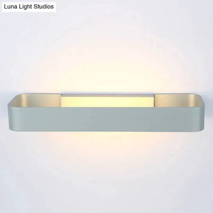 Modern minimalist black & white rectangular wall lamp by Decorbites with warm ambient glow on Tampa Home & Garden Store