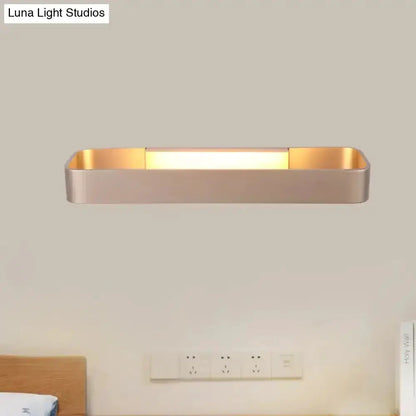 Modern minimalist black & white rectangular wall lamp with warm glow on Tampa Home & Garden Store