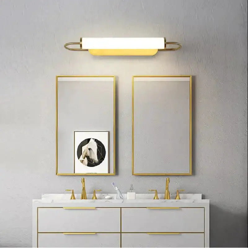 Wall lamp Decorbites gold LED cylindrical sconce with white shade in a modern bathroom setup on Tampa Home & Garden Store