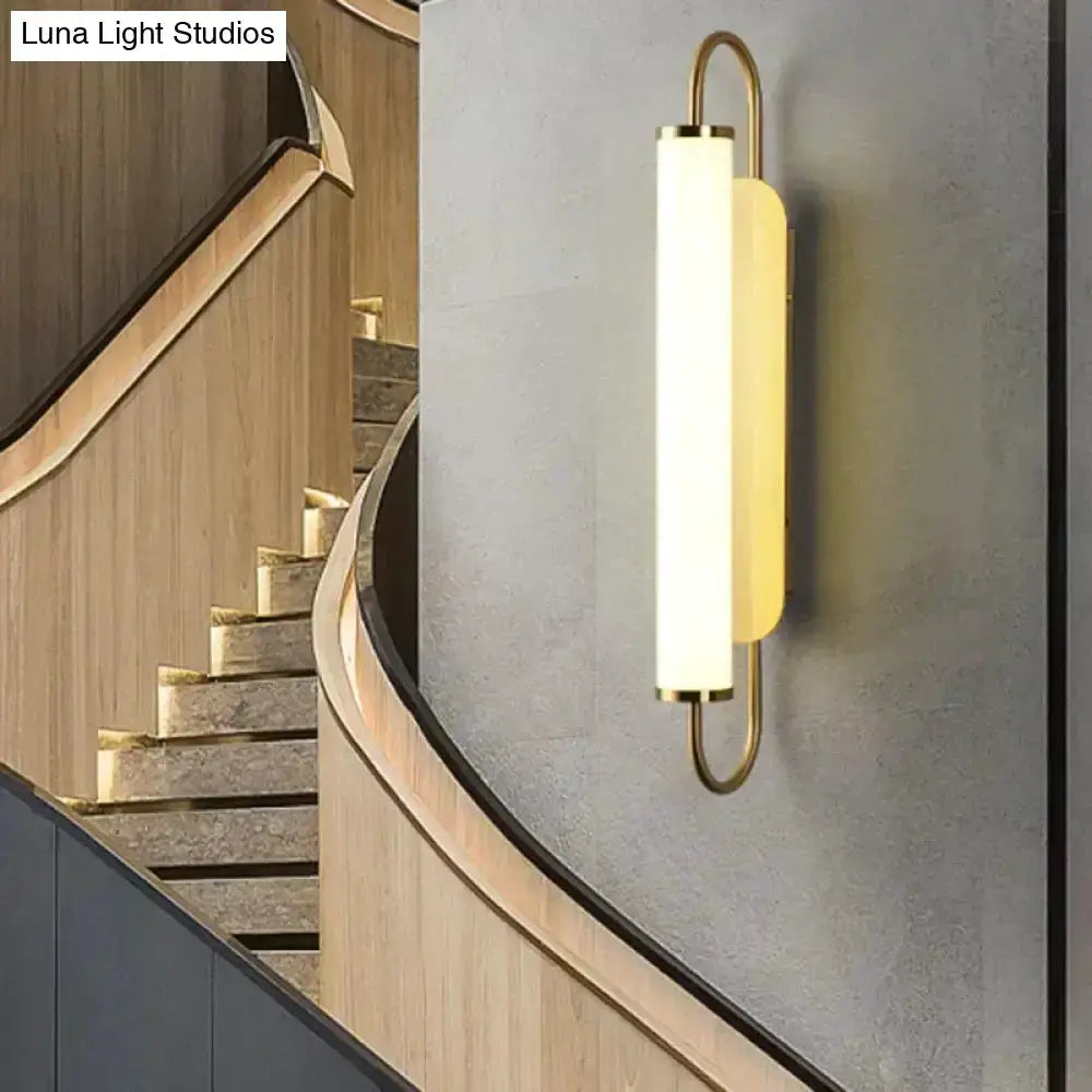 Wall lamp modern minimalist gold LED cylindrical sconce by Decorbites on grey wall on Tampa Home & Garden Store