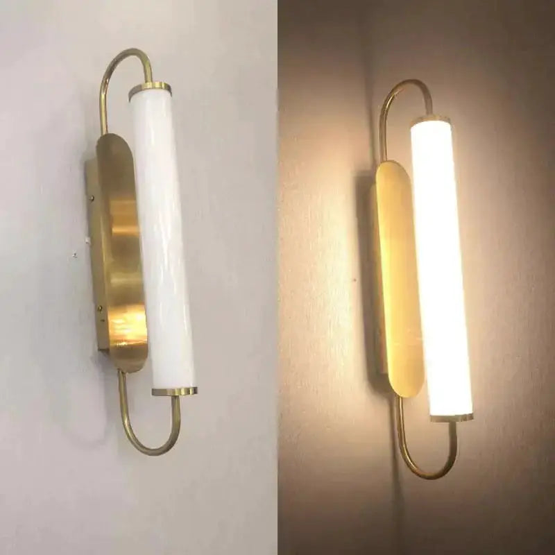 Wall lamp Decorbites gold LED with cylindrical frosted shade and brass backplate on wall on Tampa Home & Garden Store