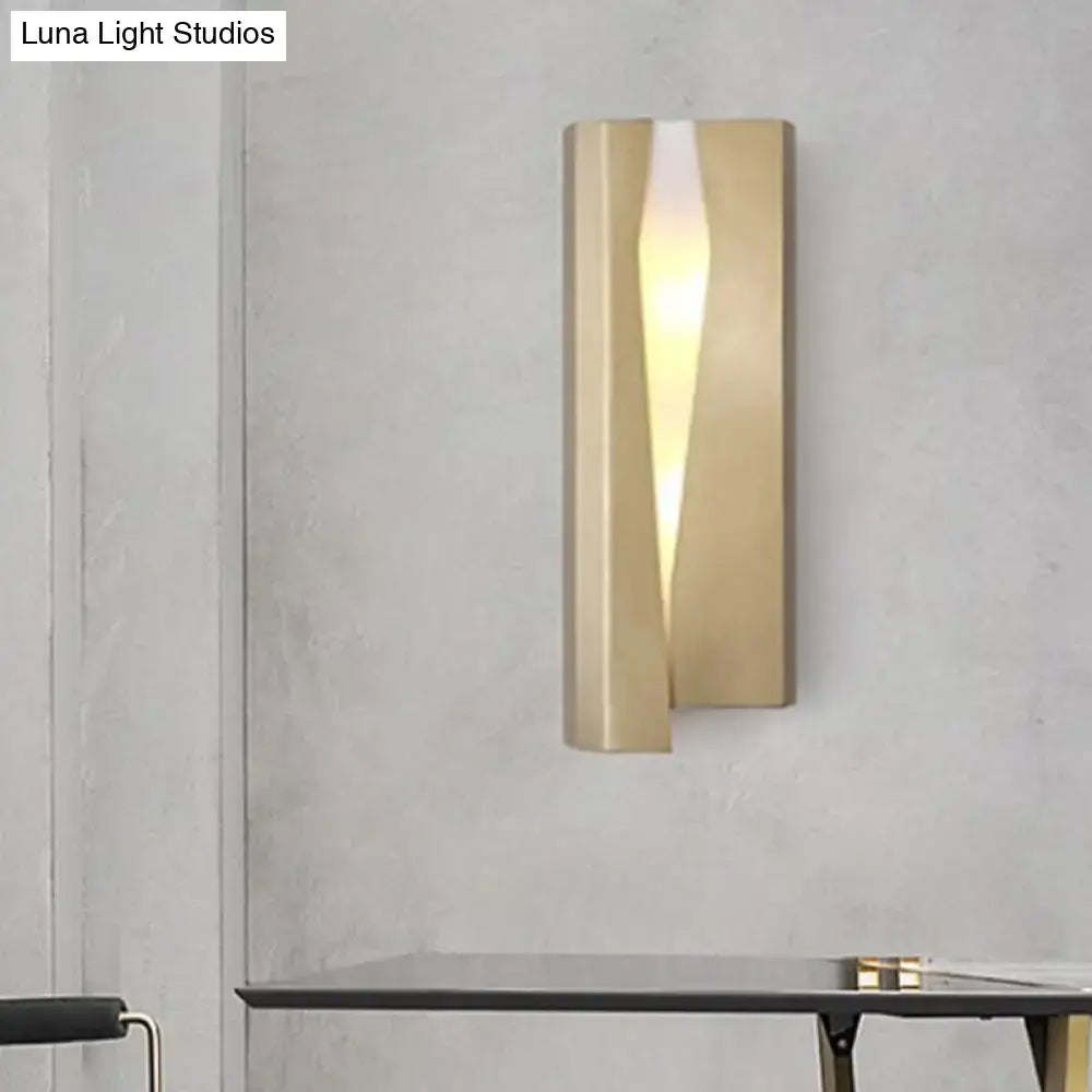 Gold rectangle wall sconce by Decorbites on gray wall brass vertical fixture with warm glow on Tampa Home & Garden Store