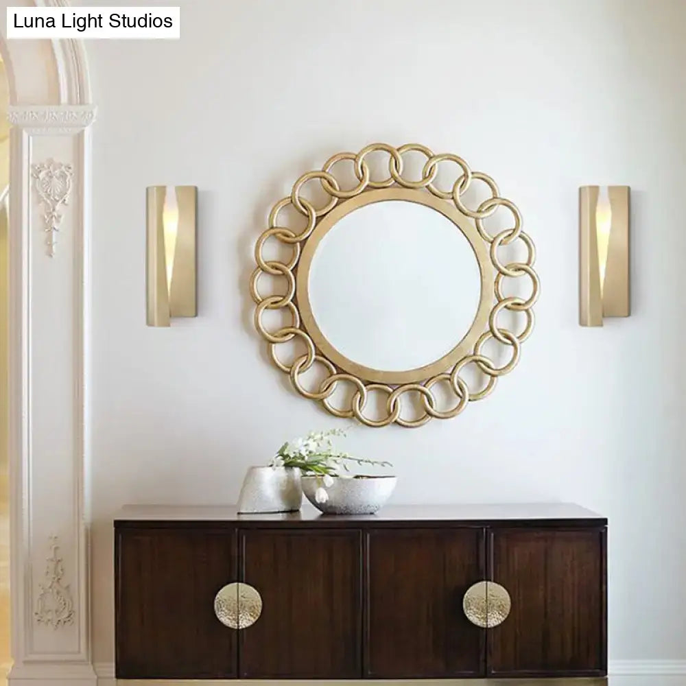 Pair of Decorbites gold rect wall sconces flanking a round mirror above a dark wood console on Tampa Home & Garden Store