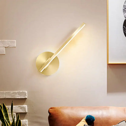 Decorbites gold tube wall sconce, brass finish with diagonal LED tube, warm wall glow on Tampa Home & Garden Store