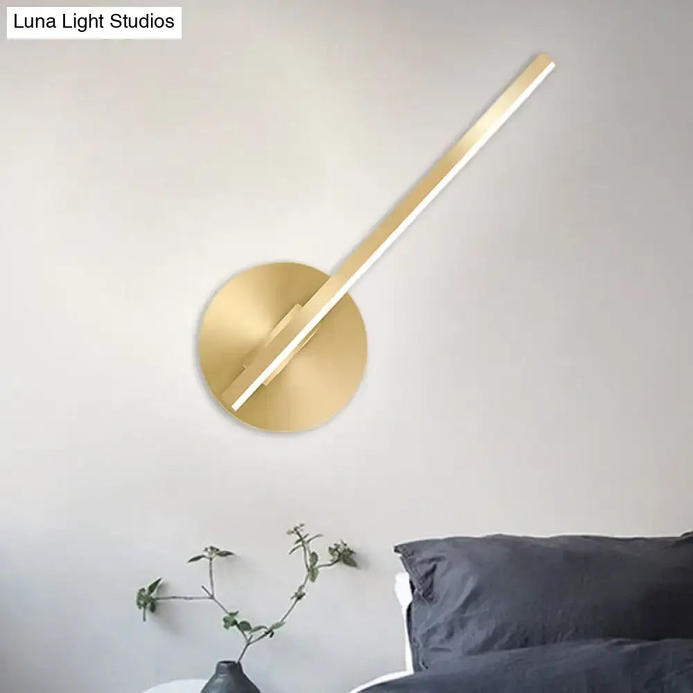 Gold tube wall sconce with round brass backplate and slender diagonal light bar Decorbites on Tampa Home & Garden Store