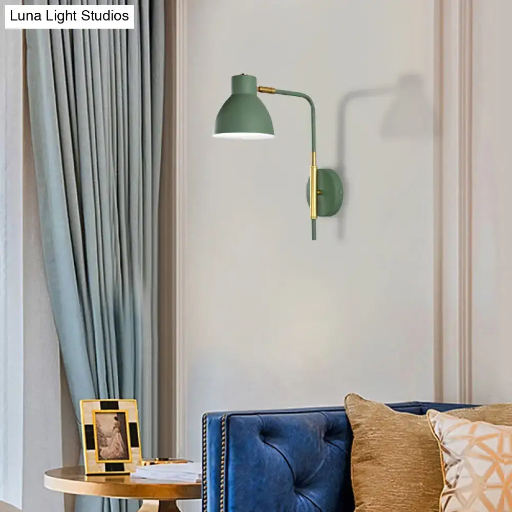 Gold Rod Wall Sconce with sage-green shade and brass hardware mounted on wall on Tampa Home & Garden Store