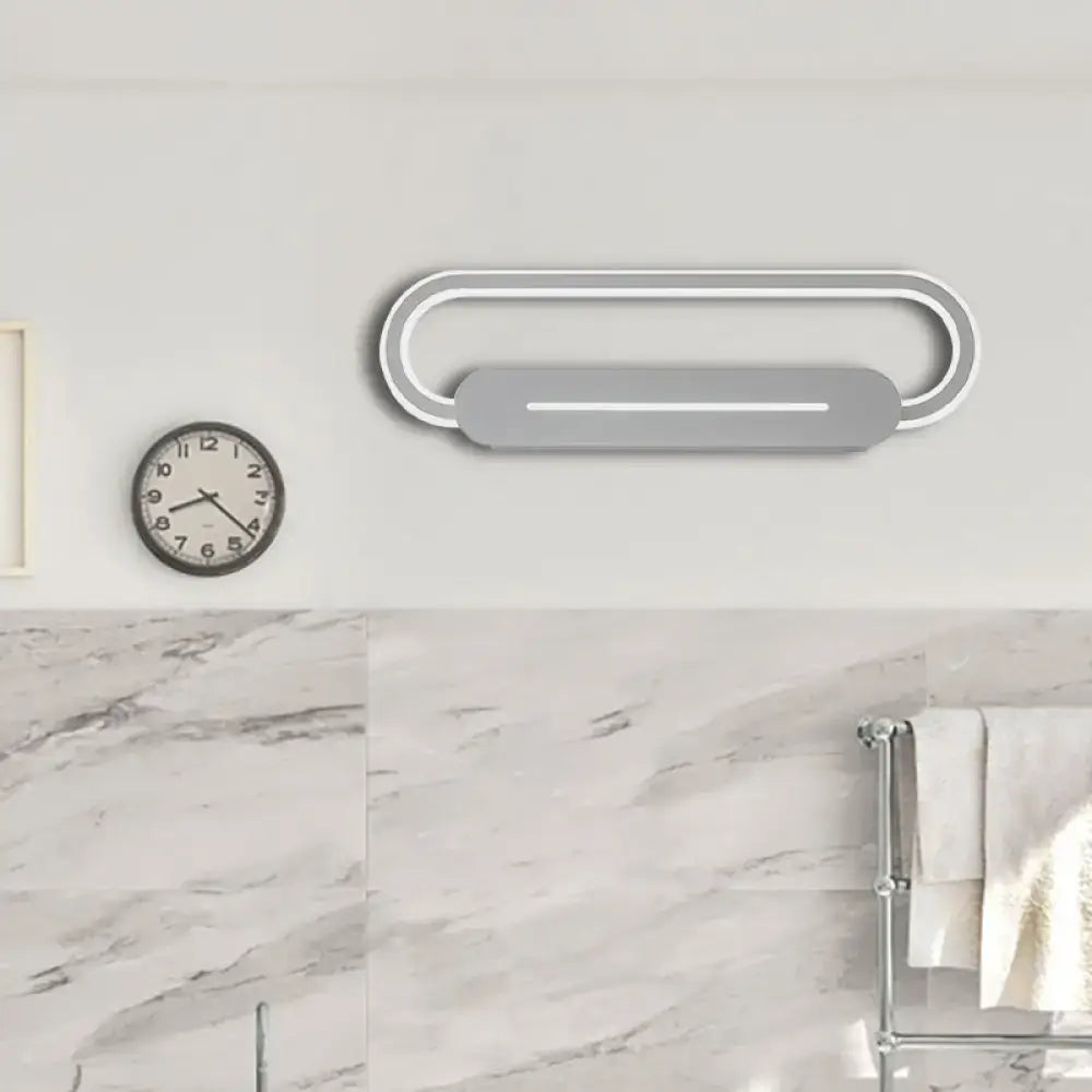 Gray oval LED wall sconce by Decorbites, modern minimalist bedroom light on Tampa Home & Garden Store