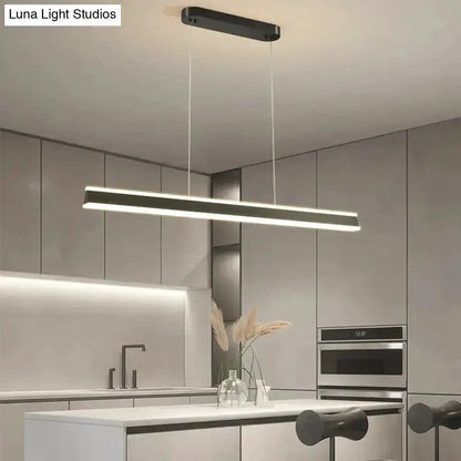 Decorbites modern black LED pendant light, minimalist linear bar over kitchen island on Tampa Home & Garden Store
