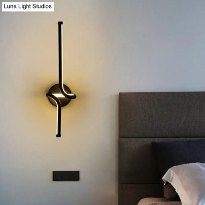 Decorbites modern minimalist metallic LED wall sconce, black metal with curved loop on Tampa Home & Garden Store