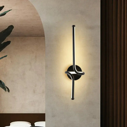 Modern minimalist metallic LED wall sconce with vertical light bars and round backplate by Decorbites on Tampa Home & Garden Store