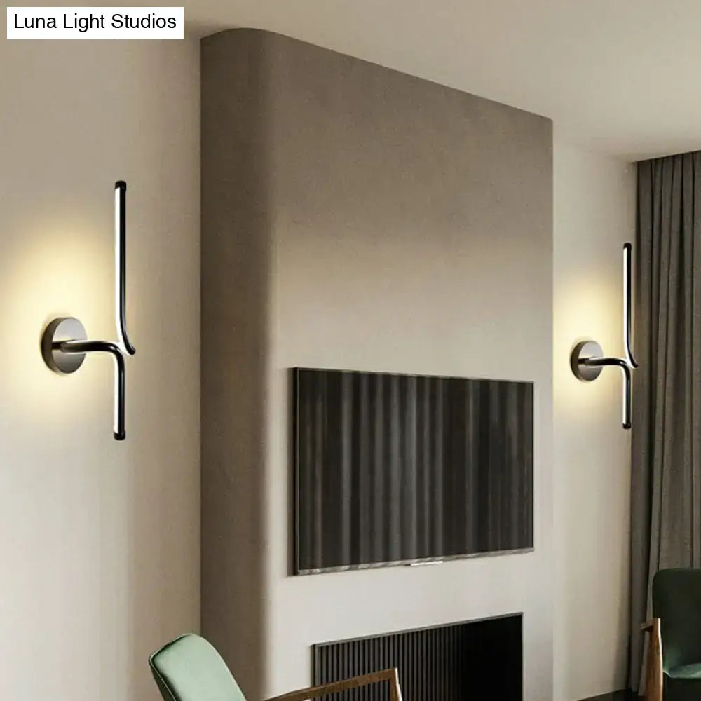 Decorbites modern minimalist metallic LED wall sconce pair, black finish, wall-mounted beside TV on Tampa Home & Garden Store