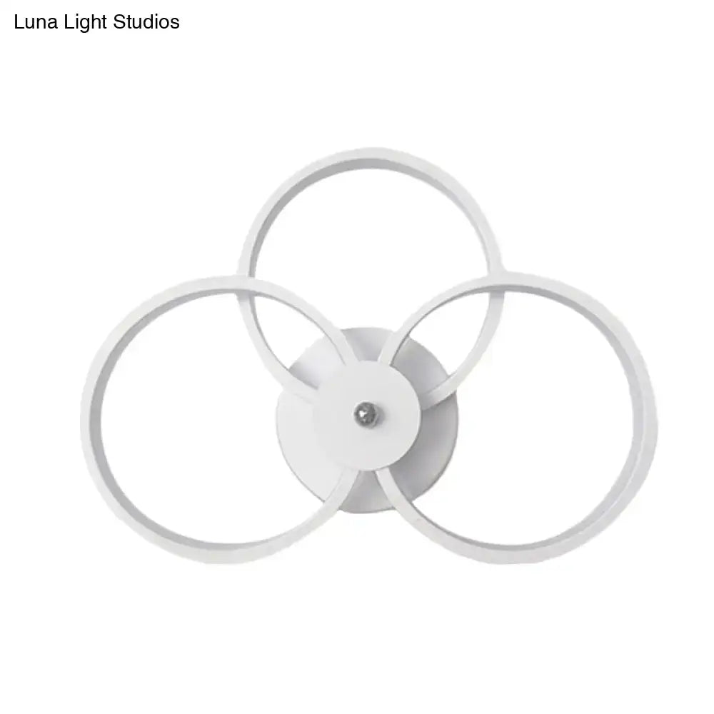 White three-ring wall sconce by Decorbites with interconnected circular frames on Tampa Home & Garden Store