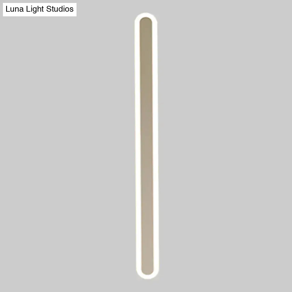 White acrylic wall sconce by Decorbites; tall slim vertical LED with rounded ends on Tampa Home & Garden Store